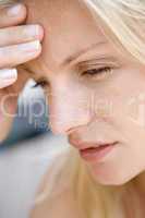 Head shot of woman scowling