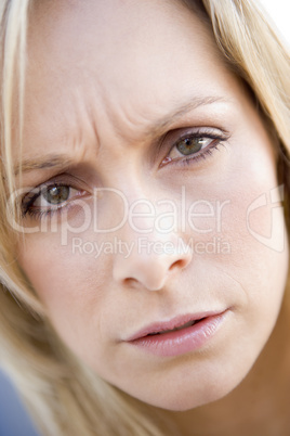 Head shot of woman scowling