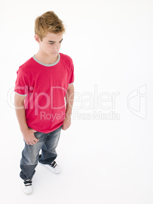 Teenage boy looking down