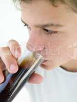 Young boy drinking soda