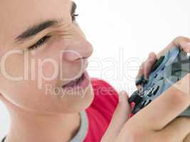 Teenage boy using videogame controller