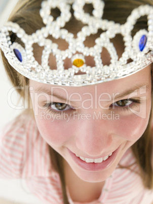 Teenage girl wearing crown and smiling