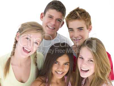 Five friends together smiling