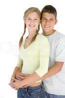 Young couple standing together smiling