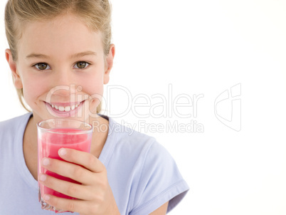 Young girl with glass of juice smiling