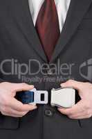 Businessman Fastening Safety Belt