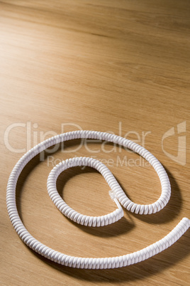 Telephone Cord Making 'At' Symbol