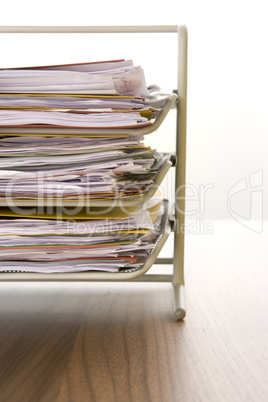 A Stack Of Paperwork Sitting In A Tray