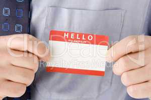 Close Up Of Businessman Attaching Name Tag