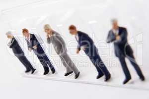 Line Of Businessmen Figurines