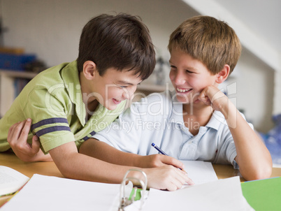 Two Young Boys Doing Their Homework Together