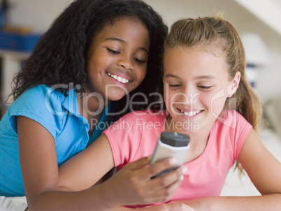 Young Girls Playing With A Cellphone