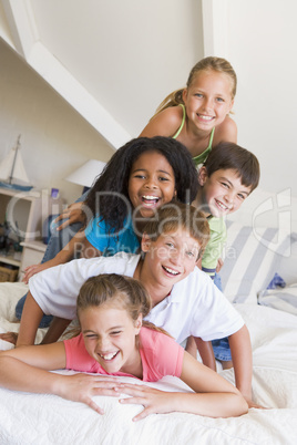 Five Young Friends Lying On Top Of Each Other