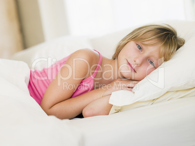 Young Girl Lying In Her Bed