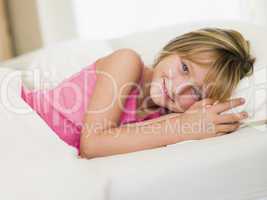 Young Girl Lying In Her Bed