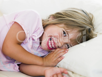 Young Girl Lying In Her Bed