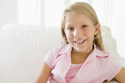 Young Girl Sitting On A Sofa