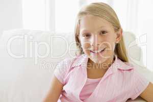 Young Girl Sitting On A Sofa