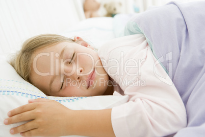 Young Girl Asleep In Her Bed