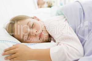 Young Girl Asleep In Her Bed