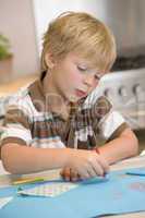 Young Boy Drawing Pictures