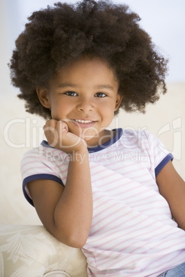 Young Girl Sitting On A Sofa