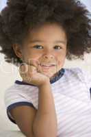 Young Girl Sitting On A Sofa