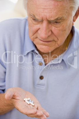 Senior Man Looking At Medicine