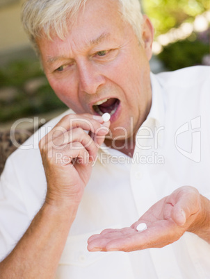 Man Taking Pills