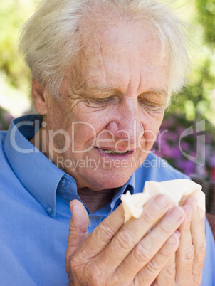 Man Blowing His Nose