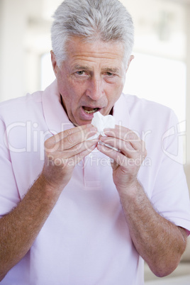 Man Blowing His Nose