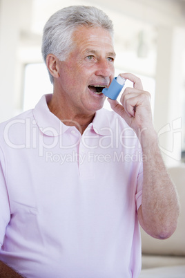 Man Using An Inhaler