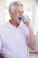 Man Using An Inhaler