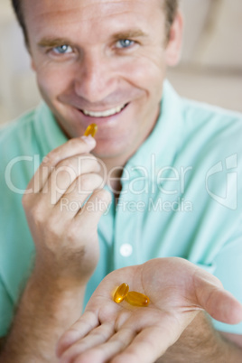 Man Taking Pills