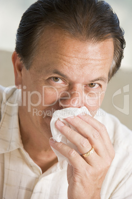 Man Blowing His Nose