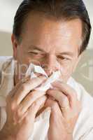 Man Blowing His Nose