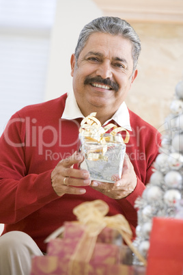 Man Excited To Open Christmas Present