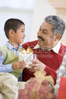 Boy Surprising Father With Christmas Present