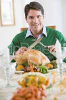 Man Preparing To Carve A Turkey