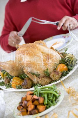 Man Preparing To Carve A Turkey