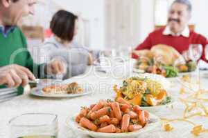 Family All Together At Christmas Dinner