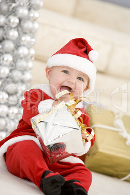 Baby In Santa Costume At Christmas