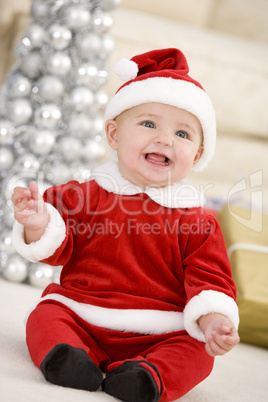 Baby In Santa Costume At Christmas