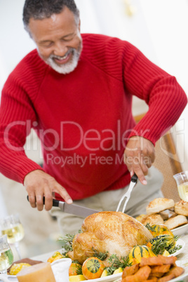 Man Carving Roast Chicken