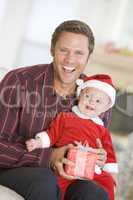 Father With Son In Santa Outfit