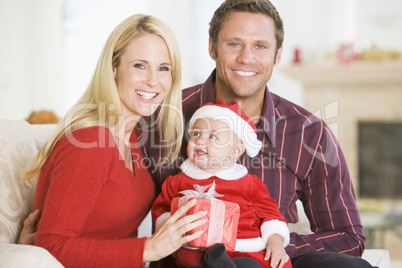 Couple With Baby In Santa Outfit