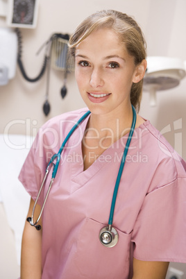 Young Female Doctor In Pink Scrubs