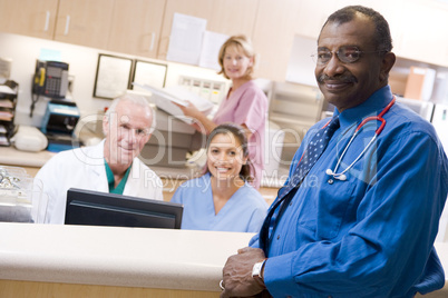 Doctors And Nurses At The Reception Area Of A Hospital