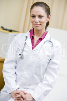 A Doctor Sitting On A Hospital Bed