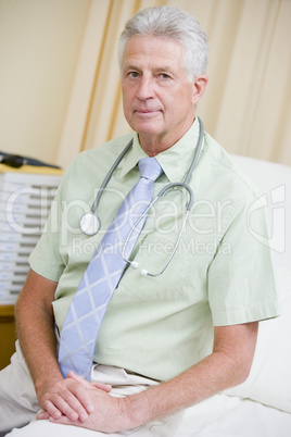 A Doctor Sitting On A Hospital Bed